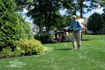 man spraying for mosquitoes