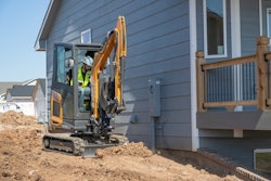 CASE CX25EV Mini Excavator working in dirt beside house