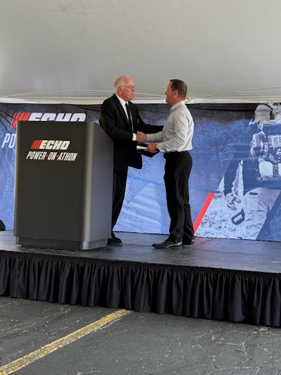 Mayor Tom Poynton presents Harold Redman with the Lake Zurich Green Business Award.