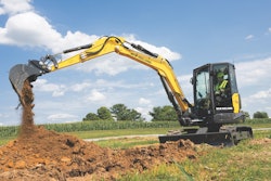 the New Holland E70D midi excavator moving dirt