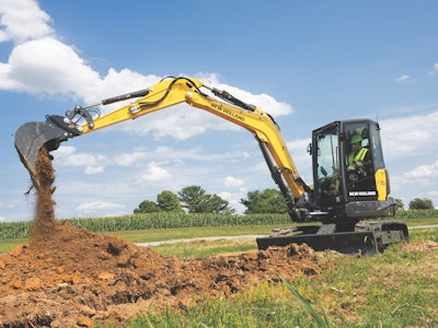 the New Holland E70D midi excavator moving dirt