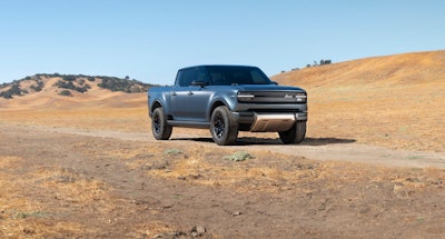 bluish gray Scout Terra pickup truck front sideview in desert