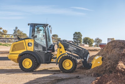 John Deere 326 P-Tier compact wheel loader with full bucket
