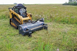 Loftness flail mower attachment on a compact track loader