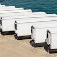 Row of white trailers on pier