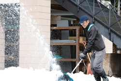 man pushing snow with Makita snow shovel