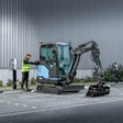 Hyundai HX19e electric mini excavator at a charging station