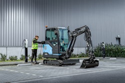 Hyundai HX19e electric mini excavator at a charging station