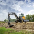 Hyundai HW100A wheeled excavator grading a ditch