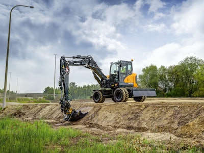 Hyundai HW100A wheeled excavator grading a ditch