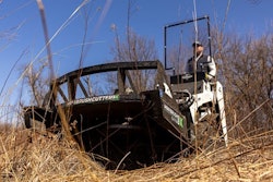 Diamond Mowers Mini Brush Cutter Pro X on a stand-on track loader