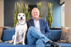 Kris Kiser poses with dog Mulligan