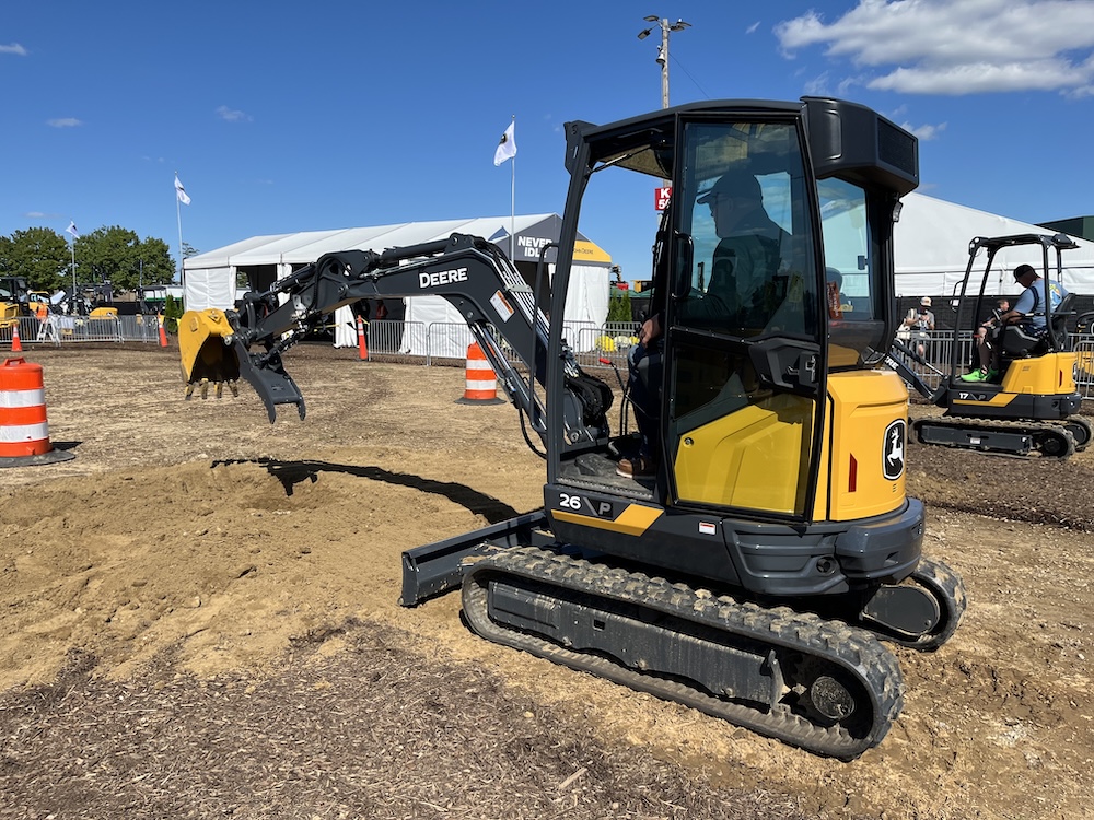 Attendees at Utility Expo 2025 try the new 26 P-Tier (foreground) and 17 P-Tier (background) compact excavators.