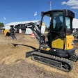 Attendees at Utility Expo 2025 try the new 26 P-Tier (foreground) and 17 P-Tier (background) compact excavators.