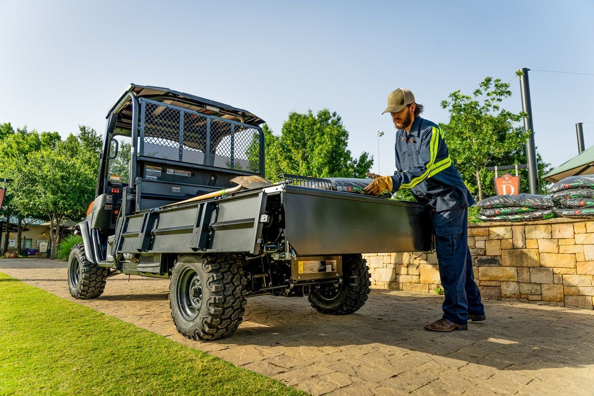 The Kubota RTV-X Long Bed can be converted to flat bed with its adjustable side rails and tailgate.