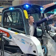 A look at Bobcat's CES booth in 2024, featuring a concept transparent Organic Light Emitting Diode touch display on a S7X electric skid steer loader.